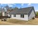 The backyard features a patio with a grill, outdoor seating, and a neatly fenced yard at 2914 Lake James Dr, Fuquay Varina, NC 27526