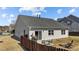 Spacious backyard showcasing outdoor seating, a grill, and a wooden fence for privacy at 2914 Lake James Dr, Fuquay Varina, NC 27526