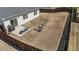 Aerial view of a fenced backyard featuring a patio, grill, seating, and fire pit at 2914 Lake James Dr, Fuquay Varina, NC 27526