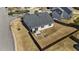 Aerial view of the fenced backyard with outdoor seating and a fire pit at 2914 Lake James Dr, Fuquay Varina, NC 27526