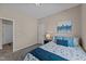 Comfortable bedroom with a cozy bed, plush carpet, and a bedside table with a lamp at 2914 Lake James Dr, Fuquay Varina, NC 27526