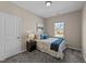 Cozy bedroom with a comfortable bed, soft carpet, and a bright window at 2914 Lake James Dr, Fuquay Varina, NC 27526