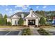 Community clubhouse with manicured landscaping and accessible entrance, offering a welcoming neighborhood amenity at 2914 Lake James Dr, Fuquay Varina, NC 27526