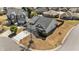 Aerial view of a two-story home featuring a driveway and well-manicured lawn at 2914 Lake James Dr, Fuquay Varina, NC 27526