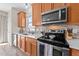 Updated kitchen with stainless steel appliances, mosaic backsplash, and bright countertops at 2914 Lake James Dr, Fuquay Varina, NC 27526