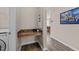 A dedicated laundry area with a built-in counter for folding and storage, located off the hallway at 2914 Lake James Dr, Fuquay Varina, NC 27526