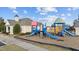 Community playground with colorful slides and climbing structures for Gathering fun and neighborhood enjoyment at 2914 Lake James Dr, Fuquay Varina, NC 27526