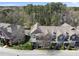 Aerial shot showcasing a well-maintained townhome community with mature trees and green spaces at 3001 Valleystone Dr, Cary, NC 27519