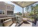 Relaxing outdoor balcony with comfortable seating and scenic neighborhood views at 3001 Valleystone Dr, Cary, NC 27519