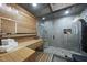 Luxurious bathroom featuring a sauna, glass shower, wooden accents and stone details at 3001 Valleystone Dr, Cary, NC 27519