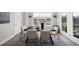 Dining room with modern table set, neutral chairs, and an abundance of natural light at 3001 Valleystone Dr, Cary, NC 27519