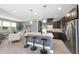 Open kitchen with granite countertops, stainless steel appliances, and a large island with seating at 3001 Valleystone Dr, Cary, NC 27519