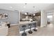 Bright, modern kitchen with a kitchen island, breakfast bar and stainless steel appliances at 3001 Valleystone Dr, Cary, NC 27519