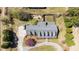 Aerial view of home showing a circular driveway, well maintained roof, and lush landscaping at 3030 Old Stage S Rd, Erwin, NC 28339