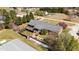 An aerial view showcasing the home's fenced yard, fire pit area, and outdoor living spaces at 3030 Old Stage S Rd, Erwin, NC 28339