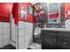 This unique bathroom features a urinal, black and white tile, and a Batman movie poster at 3030 Old Stage S Rd, Erwin, NC 28339