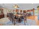 Elegant dining room with a large table, decorative rug, and an open view to the kitchen at 3030 Old Stage S Rd, Erwin, NC 28339