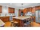 Gourmet kitchen with a center island, custom cabinets, modern appliances, and hardwood floors at 3030 Old Stage S Rd, Erwin, NC 28339