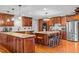 Spacious kitchen featuring custom wood cabinets, granite countertops, and stainless steel appliances at 3030 Old Stage S Rd, Erwin, NC 28339