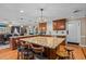 Open concept kitchen with a large island, granite countertops, and custom wood cabinetry at 3030 Old Stage S Rd, Erwin, NC 28339