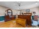 Spacious bedroom featuring wood furniture, a decorative trunk, and ample storage space at 3030 Old Stage S Rd, Erwin, NC 28339
