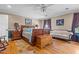 Relaxing bedroom with wood furniture, a decorative trunk, and a comfortable seating area at 3030 Old Stage S Rd, Erwin, NC 28339
