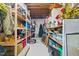 A well organized storage area with wooden shelves and a variety of containers at 3030 Old Stage S Rd, Erwin, NC 28339