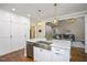 Kitchen with stainless steel appliances, custom cabinetry, and a view into living area at 306 Lochside Dr, Cary, NC 27518