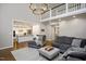 Spacious living room with kitchen view, tall ceilings, and second story landing at 306 Lochside Dr, Cary, NC 27518