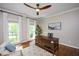 Comfortable home office featuring a ceiling fan and hardwood floors at 306 Lochside Dr, Cary, NC 27518