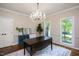 Elegant office with hardwood floors, decorative chandelier and plenty of natural light at 306 Lochside Dr, Cary, NC 27518