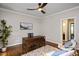 Comfortable home office featuring a ceiling fan and hardwood floors at 306 Lochside Dr, Cary, NC 27518