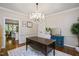Elegant office with hardwood floors, decorative chandelier and plenty of natural light at 306 Lochside Dr, Cary, NC 27518