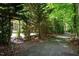 An inviting walking path lined with lush trees and greenery at 306 Lochside Dr, Cary, NC 27518