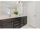 Bright bathroom with double sink vanity, decorative plant, and well-lit mirror at 31 E Dentaires Way, Willow Springs, NC 27592