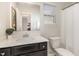 Bright bathroom featuring a dark vanity with white countertop, modern fixtures, and natural light at 31 E Dentaires Way, Willow Springs, NC 27592