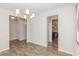 Neutral dining room featuring modern chandelier and hardwood floors at 31 E Dentaires Way, Willow Springs, NC 27592