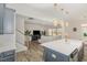 Open kitchen design with a central island, stainless appliances, and modern fixtures at 31 E Dentaires Way, Willow Springs, NC 27592