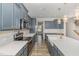Beautiful kitchen features stainless appliances, white countertops, subway tile, and stylish hanging lights at 31 E Dentaires Way, Willow Springs, NC 27592