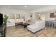 Spacious living room with wood floors, large windows, and an open floor plan at 31 E Dentaires Way, Willow Springs, NC 27592