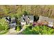 Attractive aerial shot of a home surrounded by lush trees and manicured lawns at 3308 Forest Mill Cir, Raleigh, NC 27616