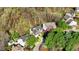 Lovely aerial view shows homes nestled among lush, mature trees and landscaping at 3308 Forest Mill Cir, Raleigh, NC 27616