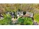 Stunning aerial view of a neighborhood with mature trees and well-maintained homes at 3308 Forest Mill Cir, Raleigh, NC 27616