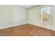 Light green bedroom with hardwood floors and a window at 3308 Forest Mill Cir, Raleigh, NC 27616