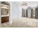 Spacious bedroom featuring neutral walls, a ceiling fan, and large windows at 3308 Forest Mill Cir, Raleigh, NC 27616