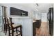 Modern kitchen with bar seating, dark cabinets, an island, and stainless appliances at 3308 Forest Mill Cir, Raleigh, NC 27616