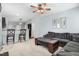 Open concept living room and kitchen with bar seating and comfortable sofa at 3308 Forest Mill Cir, Raleigh, NC 27616