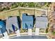 Aerial view of rooftops and fenced backyards, showcasing the community layout with mature trees at 3417 Mission Olive Pl, New Hill, NC 27562
