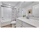 Well-lit bathroom with a vanity, sink, toilet, and shower/tub combo with modern fixtures and neutral tones at 3417 Mission Olive Pl, New Hill, NC 27562