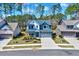 Charming two-story home with a well-manicured lawn, a two-car garage, and attractive curb appeal at 3417 Mission Olive Pl, New Hill, NC 27562